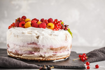 Healthy vegan cake with coconut cream and berries. Healthy vegan food concept.