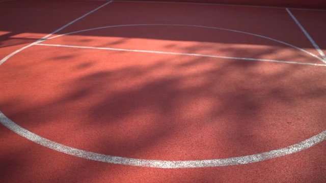 Streetball court with white lines on red background