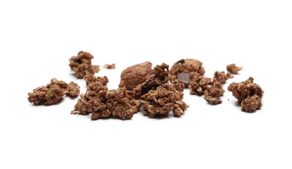 Crunchy chocolate granola, muesli pile isolated on white background