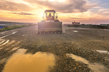 Excavator at the end of a working day in a construction site