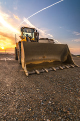 Excavator at the end of a working day in a construction site © Enrique del Barrio