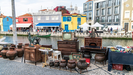 Fototapeta na wymiar Some items on sale at the monthly street flea market by the canals in Aveiro, Portugal