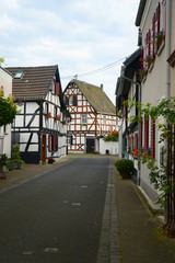 Obraz premium old small German town on the river bank narrow streets, pavement flowers on the windows