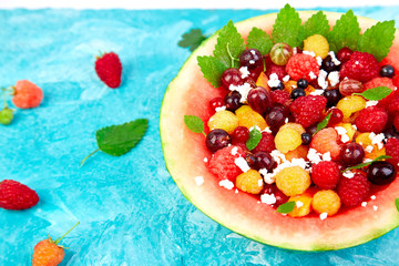 Fototapeta na wymiar Watermelon bowl with cottage cheese and berries