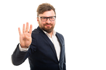 Portrait of business man showing number four with fingers.