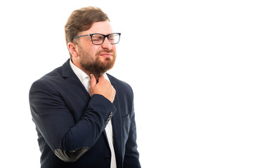 Portrait of business man showing throat pain gesture.