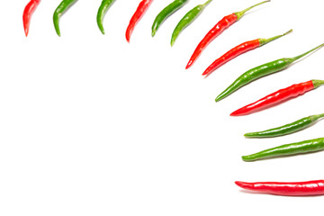 Red and green chili peppers on white background with copy space