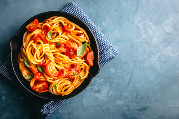Italian pasta with tomato sauce in pan