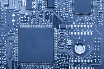 Electronic board. The board features elements: chips, diodes, capacitors, chokes. Shallow depth of...