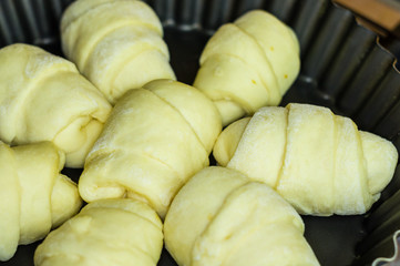 raw homemade croissants with sweet filling