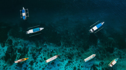 Small boats sailing in ocean