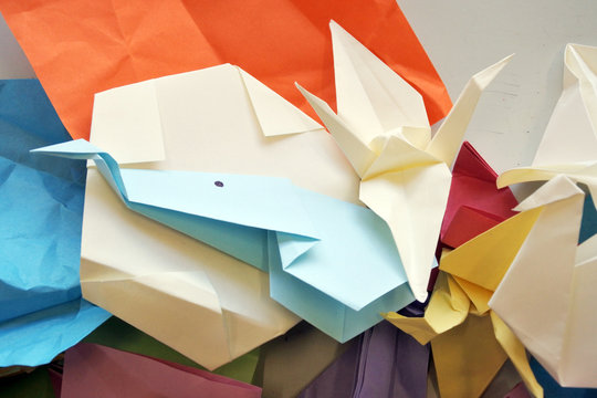 Origami shapes on a Table Bacground