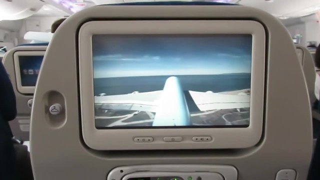 View of seatback screen as plane takes off