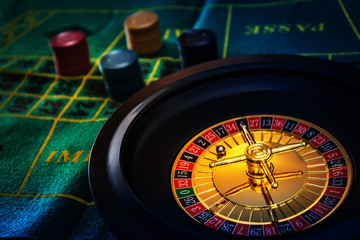 Casino playing roulette on green table