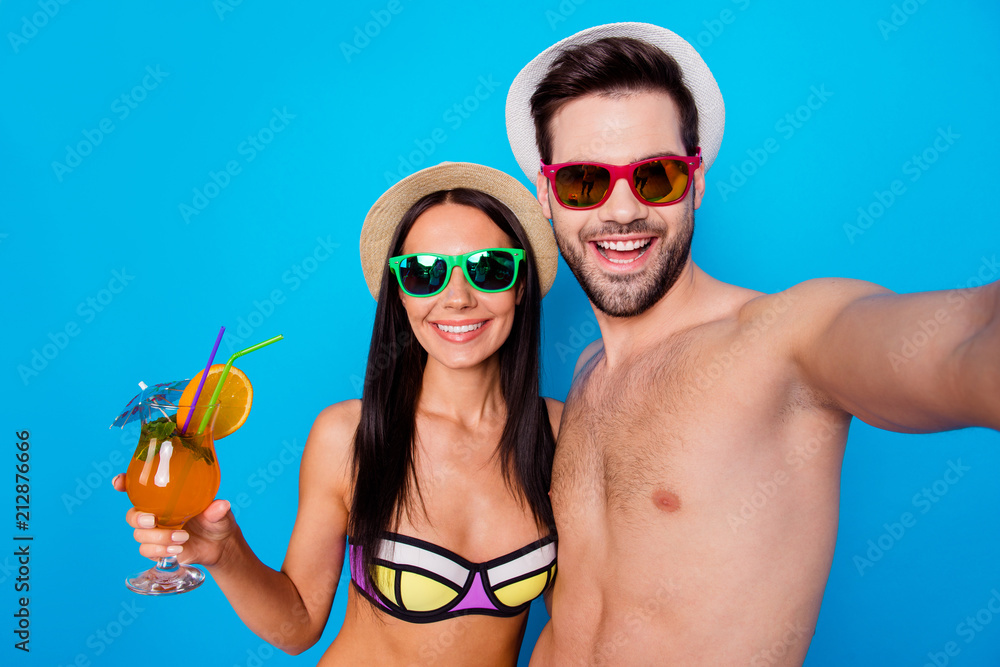 Sticker self portrait of couple with coctail on beach vacation in modern eyeglasses headwear shooting selfie