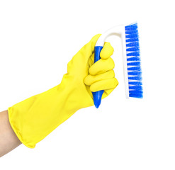 Hand in yellow cleaning rubber glove with cleaning brush isolated on white background.