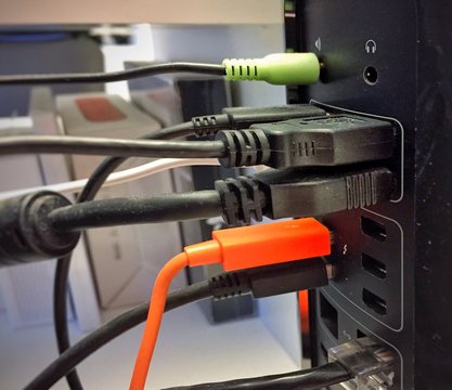 A group of usb cables plugged into a computer