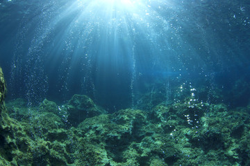 Fototapeta na wymiar Underwater ocean background with air bubbles in water 