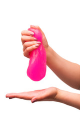 a toy for children mucus and liquid flowing on hand on a white background