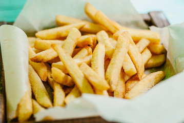 French fries on a wooden board