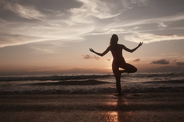 meditation and yoga on the beach / summer vacation concept health beauty, summer vacation yoga classes on the sea shore