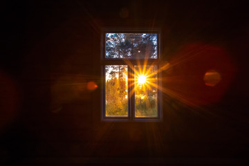 Sunset view in old window. Photo from Sotkamo. - Powered by Adobe