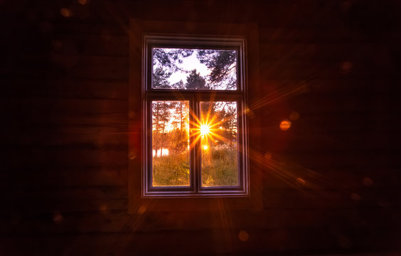 Sunset view in old window. Photo from Sotkamo.