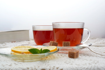 hot black tea with lemon and mint fragrant fresh glass glass still life hand glass