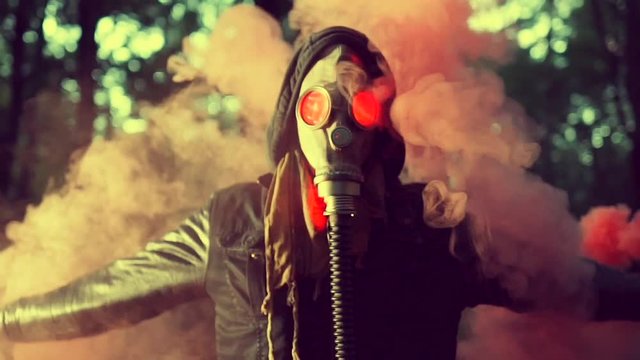 People with Gas masks waving Smoke candles