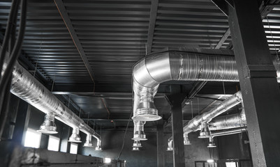 Ventilation system on the ceiling of large buildings. Ventilation pipes in silver insulation...