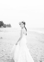 Fototapeta na wymiar Beautiful bride by the sea