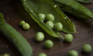 Close up of a green pea pod food photography recipe idea