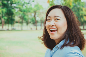 Outdoors portrait of beautiful asia women laughing, Happiness Concept.