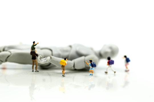 Miniature people : student children with model robot,modern technology concept. Stem education.