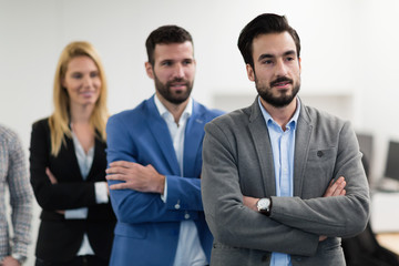 Successful team of young perspective businesspeople in office