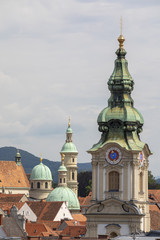 roof scape  with tower stadtpfarrkirche in the city of graz, austria