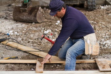 bricklayer at work in a building site