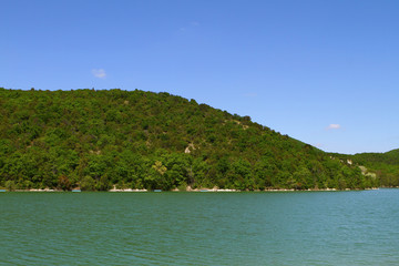 Green hill in country side at summer on the shore