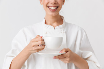 Cropped image of a cheerful young woman cook