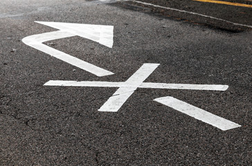 Crossed white arrow, road marking