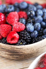 Various beautiful summer berries covered by water drops.
