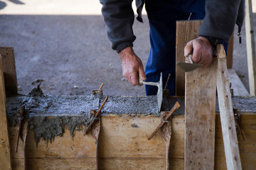 bricklayer at work in a building site