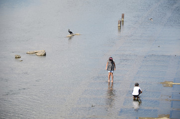 Two kids playing at the stream, Kyoto.