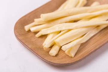 Healthy Snack. Smoked string cheese. Kobarcik. Selective focus
