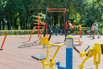 Fototapeta na wymiar Kiev, Ukraine, -07 July, 2018: Playground with sports simulators in the park.