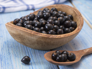 black currant on a wooden table. 