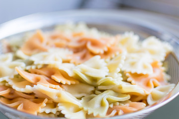 Multicolored boiled pasta.