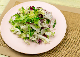 Vegetarian salad of fresh vegetables on a plate.