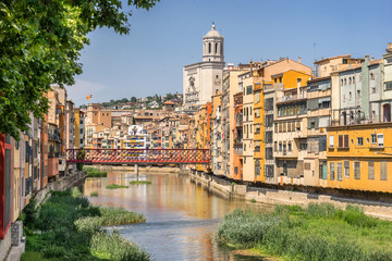 Fototapeta na wymiar Looking down the Onyar River to the Eiffel bridge in Girona