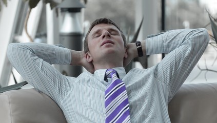 serious handsome businessman relaxing in the lobby © ASDF